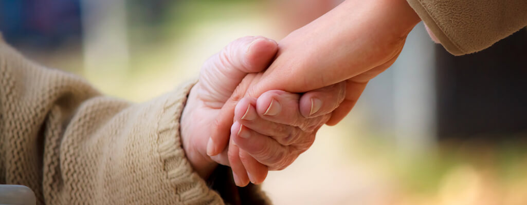 Elderly and Young Hands Holding