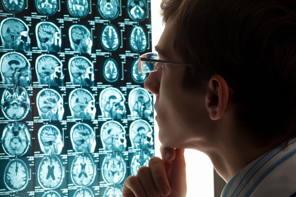 Radiologist Examining Brain Scans